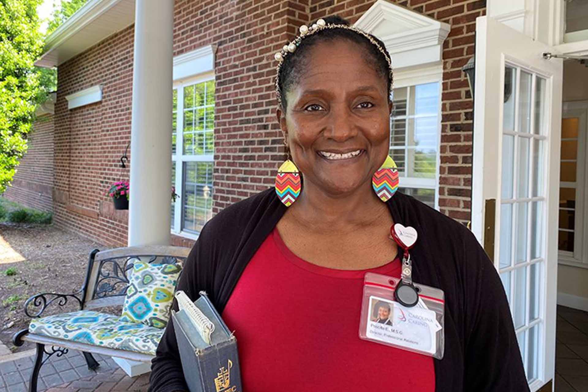 A team member leads a music program for dementia patients