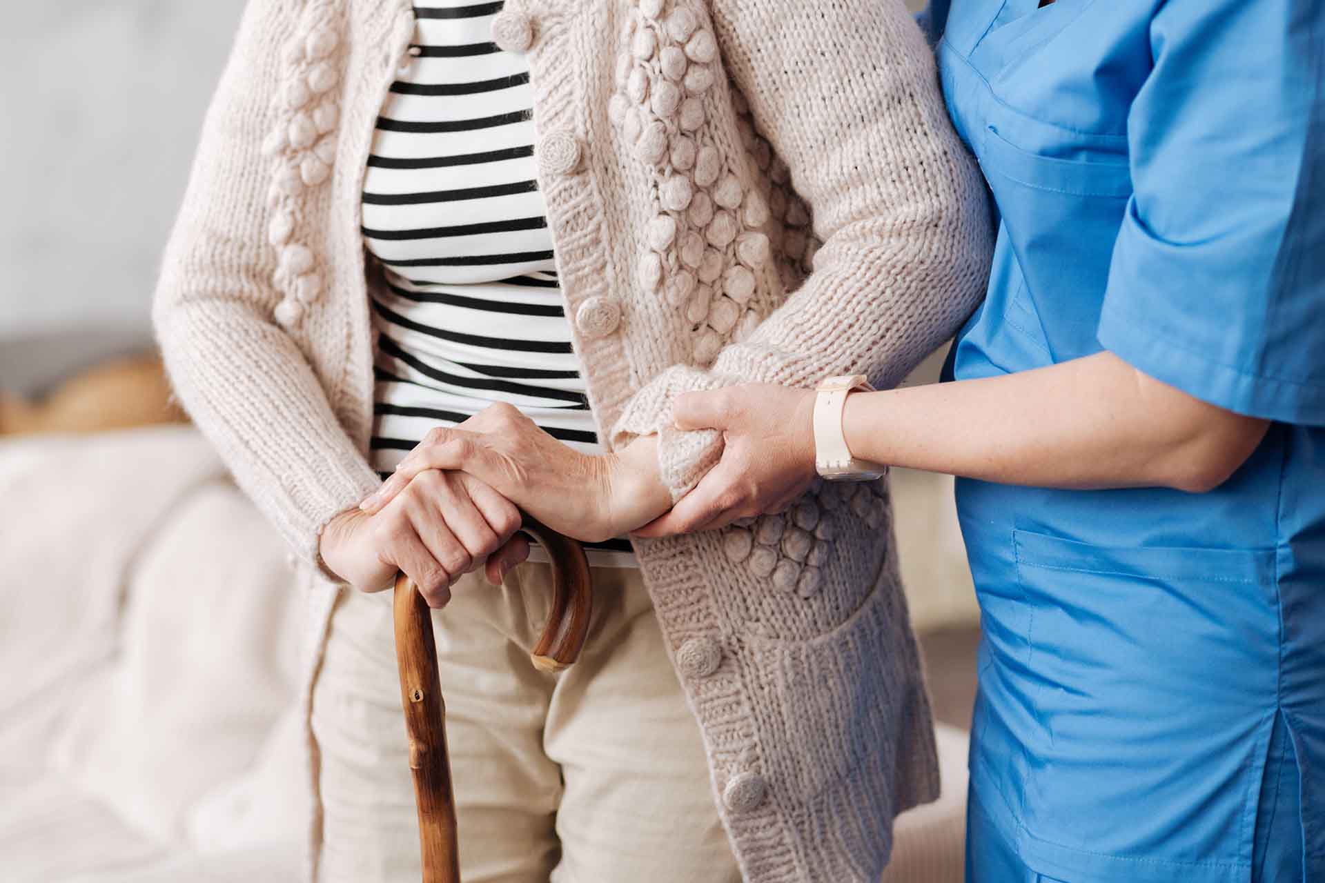 A home care assistant helps a senior adult