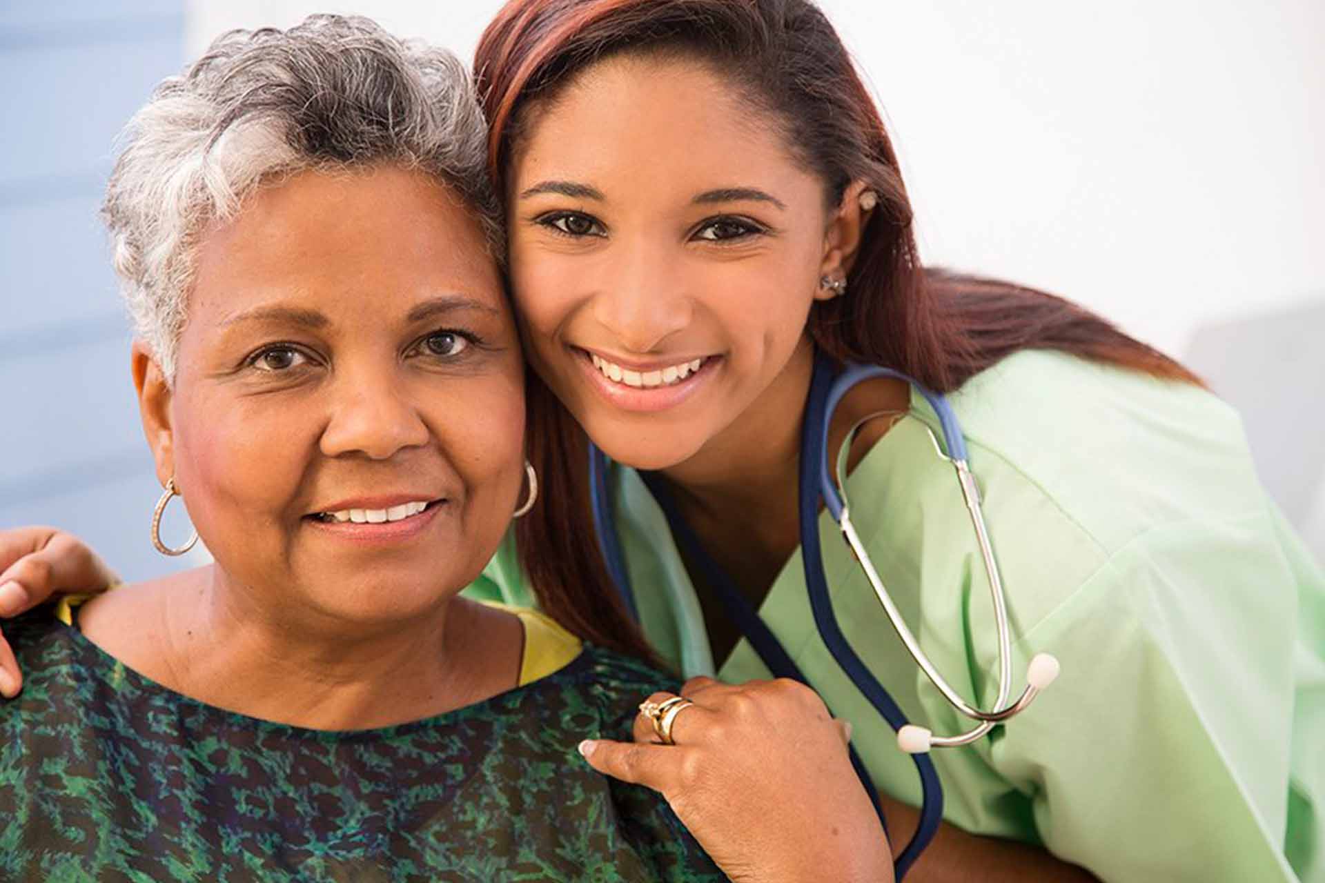 A Palliative Care nurse with a stroke patient