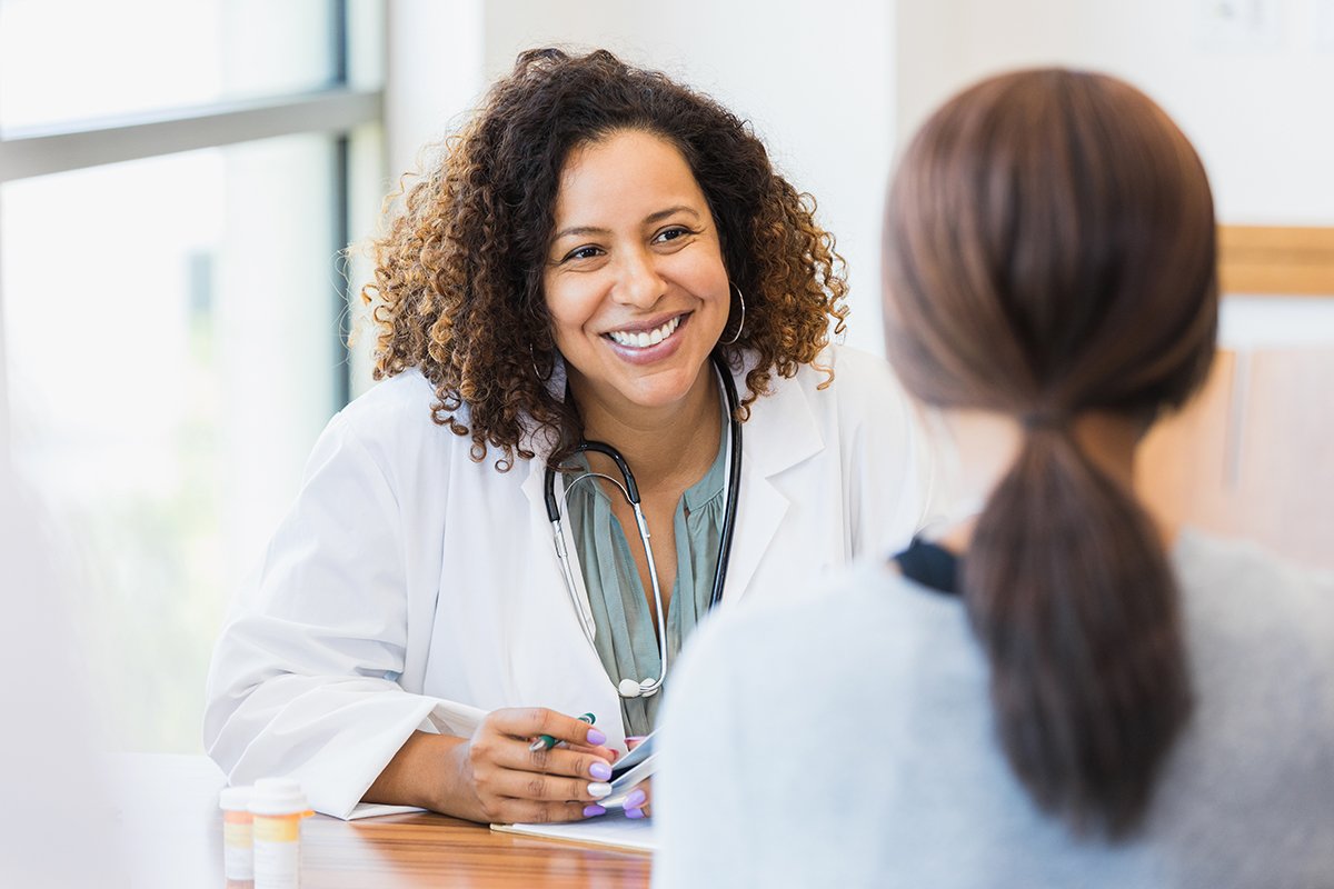 Caring doctor listens to patient